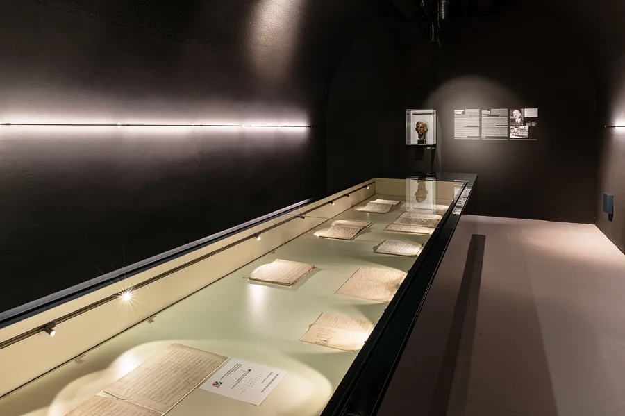 Large illuminated display case with originals in the ‘Treasure Chamber’ museum room.