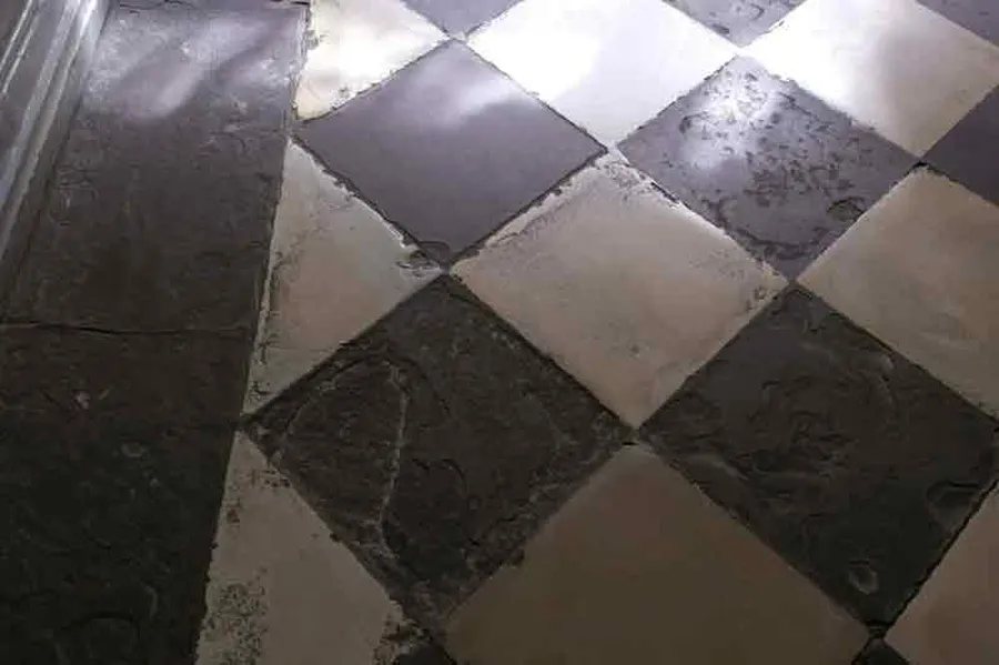 The busy corridor on the ground floor of the Beethoven-Haus is covered with black and white stone tiles.